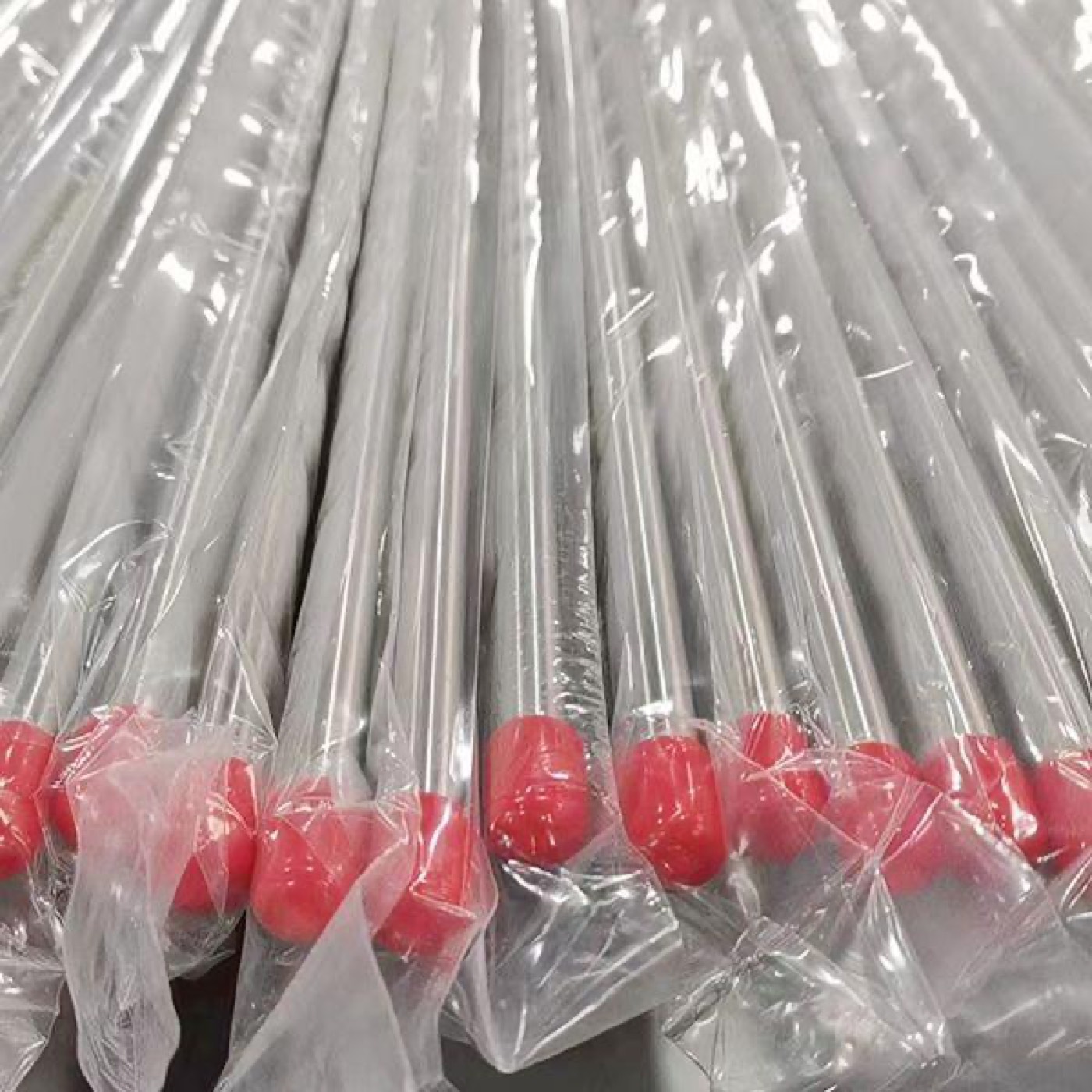 Capped and bagged high-purity stainless steel instrumentation tubing prepared for clean installation environments